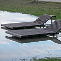 Chaise longue in the puddle